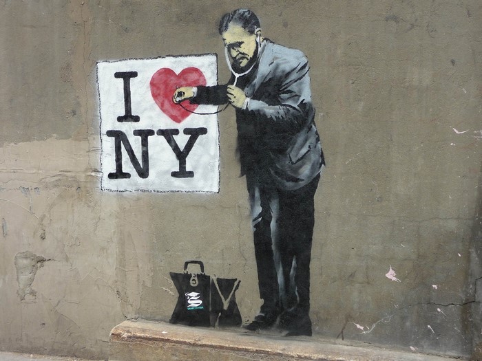 Graffiti of a doctor examining the 'I Love NY' logo