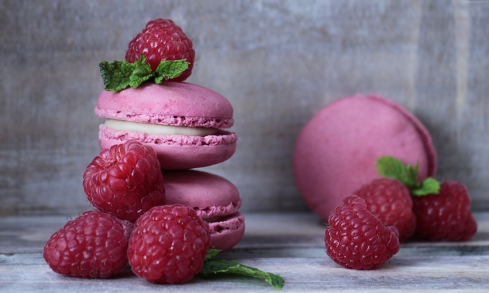 Pink raspberry macarons with mint and fresh raspberries