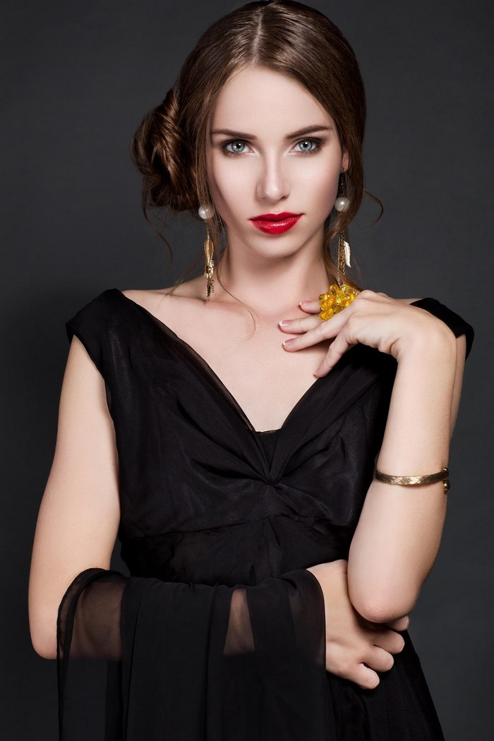 Elegant Woman in Black Dress with Red Lipstick