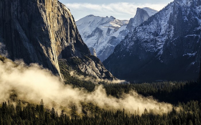 Misty Yosemite Valley with Snow-Capped Mountains