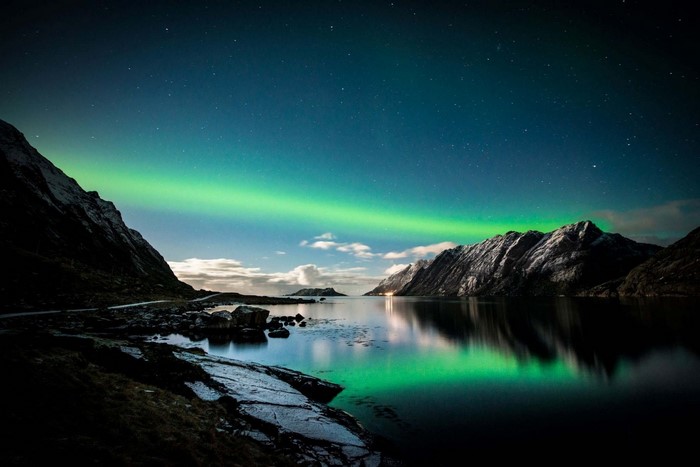 Aurora Borealis over a Fjord with Mountains