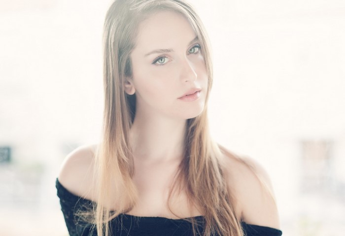 Portrait of a young woman with long blonde hair