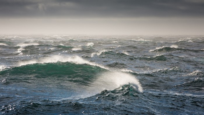 Stormy ocean with large waves under a cloudy sky