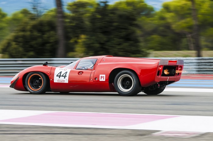 Red Ford GT40 race car with number 44 on track