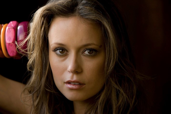 Portrait of a Woman with Long Brown Hair and Bracelets