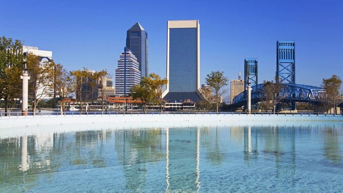 Jacksonville skyline with bridges and reflection in water