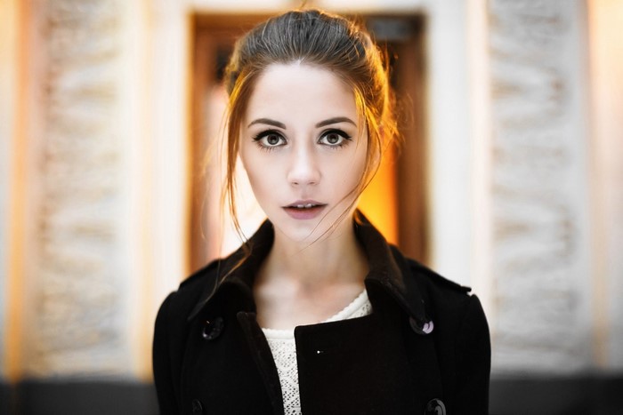 Portrait of Ksenia Kokoreva in a black coat
