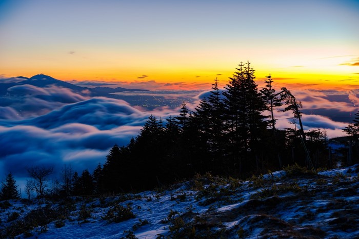 Mountain landscape with clouds at sunset