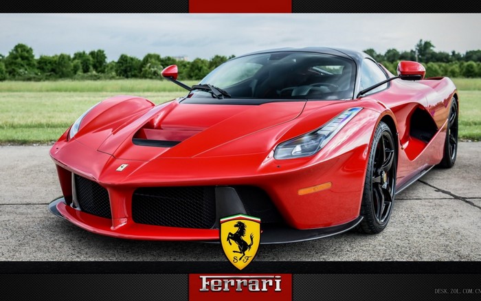 Red Ferrari LaFerrari parked on asphalt