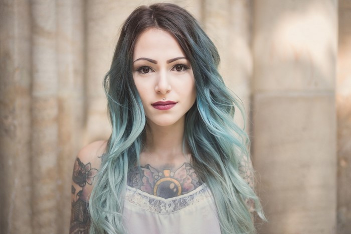 Portrait of Woman with Long Blue Dyed Hair and Tattoos