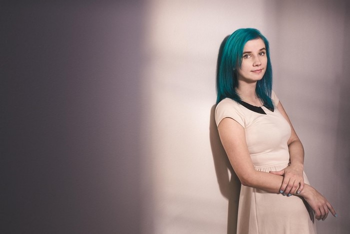 Woman with blue hair in a dress