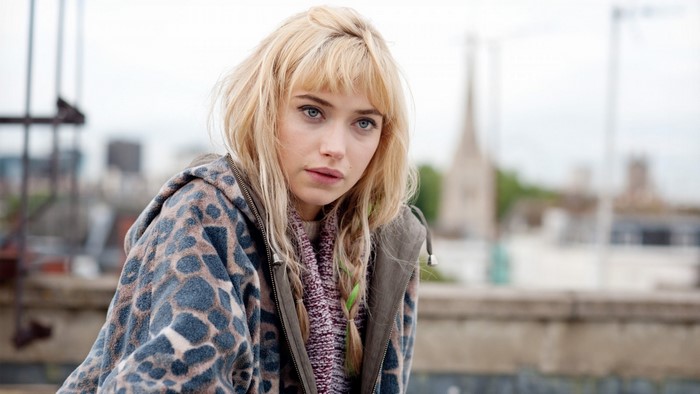 Imogen Poots portrait with blonde hair and braided pigtails