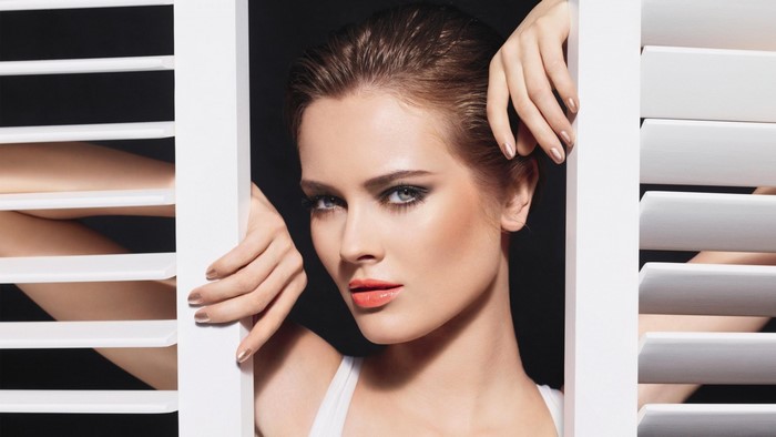 Woman with dramatic makeup and wet hair