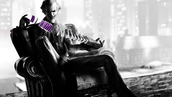 Joker from Batman sitting with cards