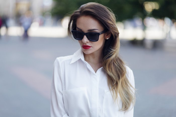 Sylwia Nowak wearing sunglasses and a white blouse