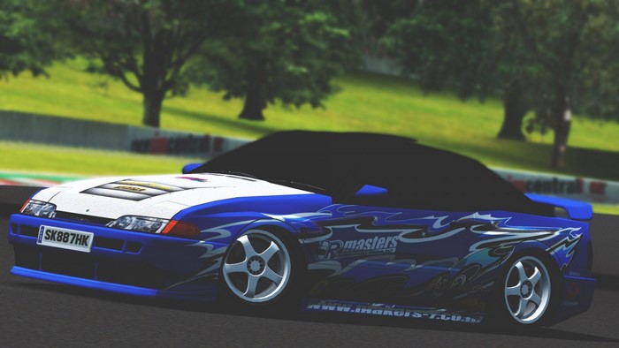 Blue and white Nissan Silvia S13 drift car on a race track