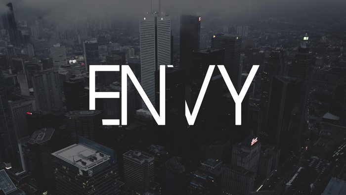 Envy typography over a dark cityscape