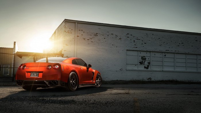 Orange Nissan GT-R with large rear spoiler