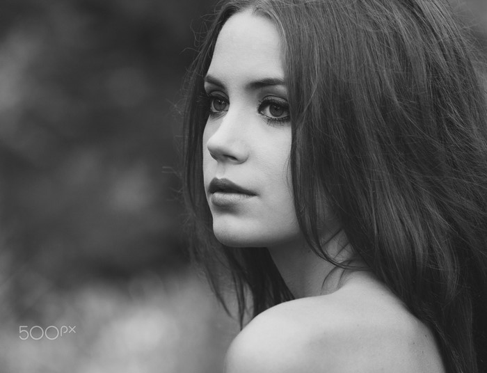 Monochrome portrait of a young woman with long hair