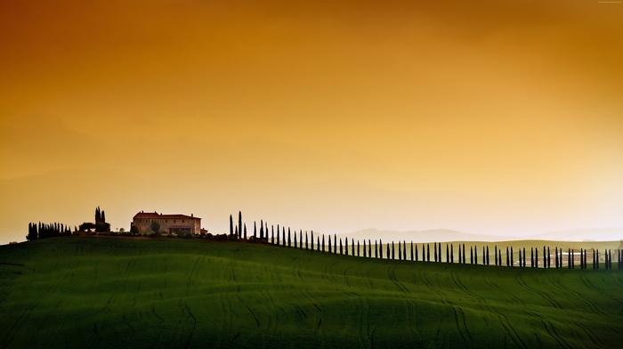 Tuscany landscape with cypress trees and villa