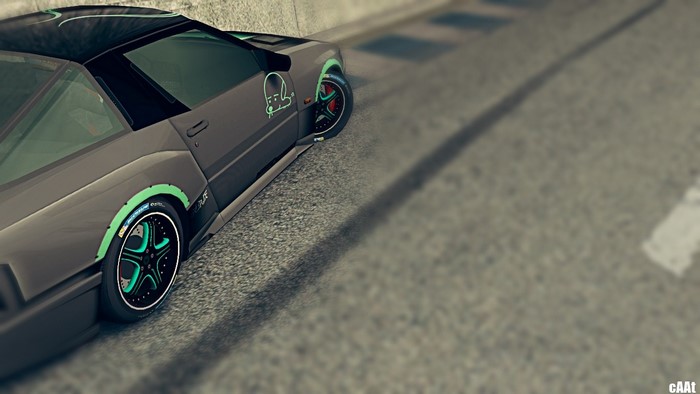 Sports car with custom rims on a road