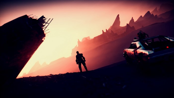 Man and car in a desolate landscape at sunset