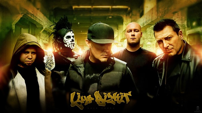 Limp Bizkit band members in a dark urban setting