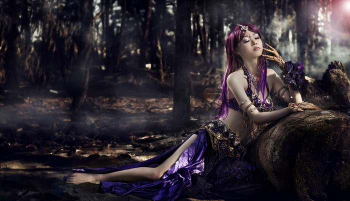 Fantasy Purple-Haired Woman in Mystical Forest