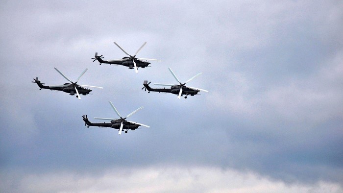 Four Mi-28 helicopters in formation flight