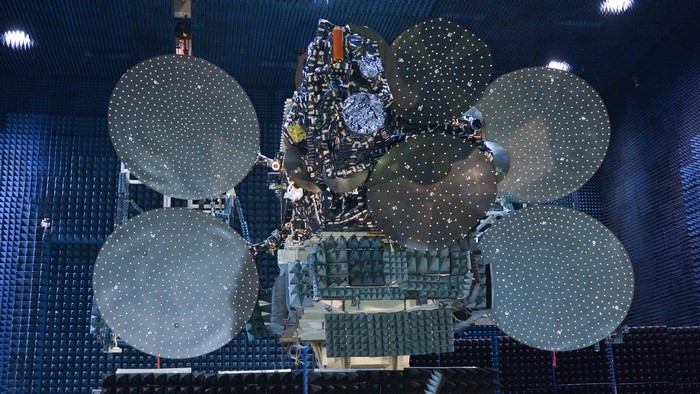 Satellite with large dishes in an anechoic chamber