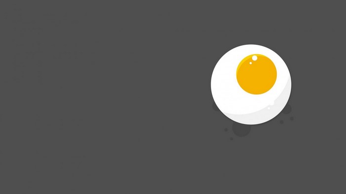 Minimalist fried egg on dark background