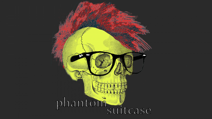 Skull with mohawk and glasses, text "phantom suitcase"
