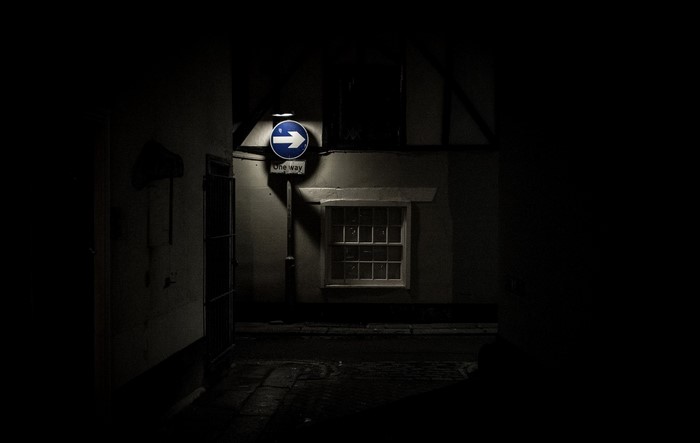 One Way Sign at Night