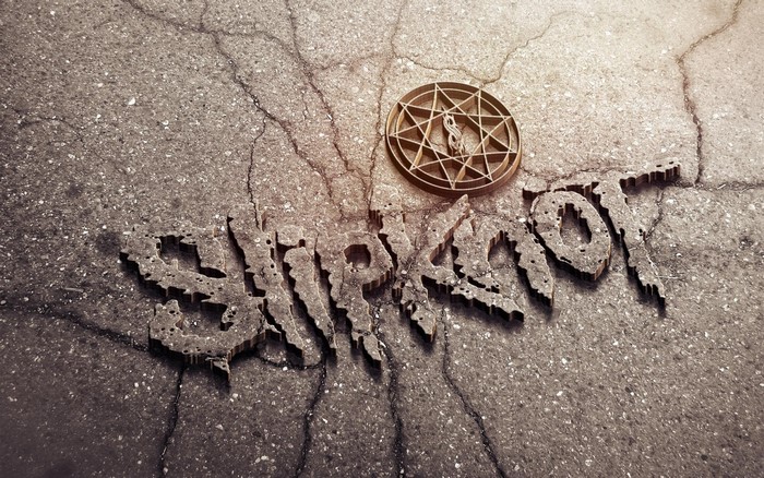Slipknot logo on cracked concrete with symbol