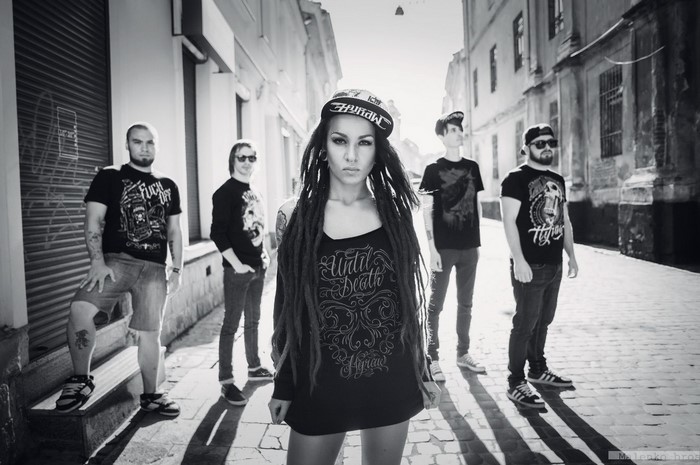 Jinjer band members posing on a street