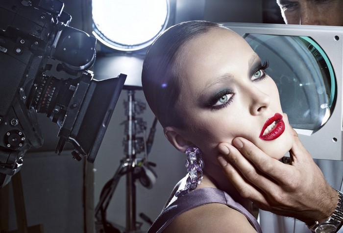 Model with dramatic makeup in a photo studio