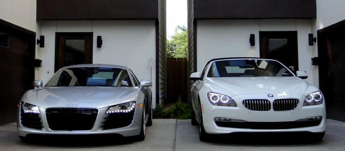 Silver Audi R8 and white BMW 6 Series parked