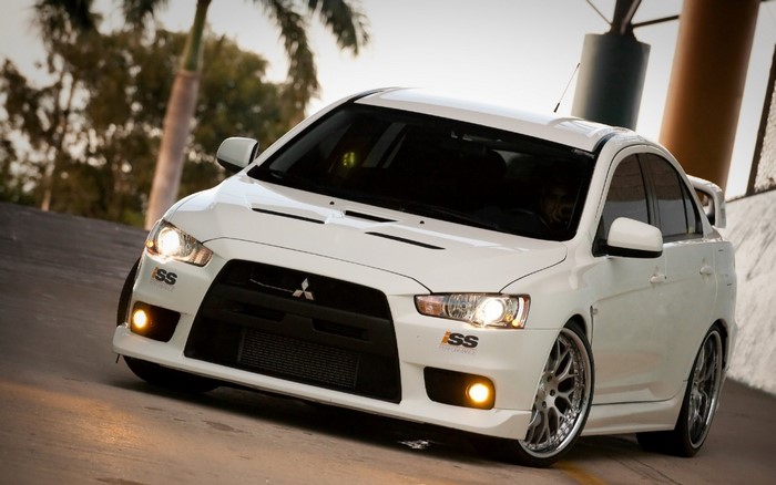 White Mitsubishi Lancer Evolution X sports car