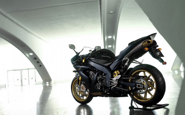 Black and gold Yamaha YZF R1 motorcycle indoors
