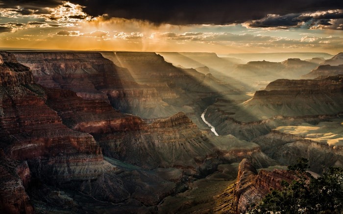 Grand Canyon Sunrise with Sun Rays Over Canyon Valley