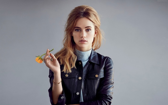 Suki Waterhouse with a flower