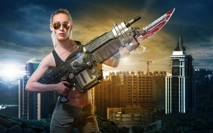 Woman with futuristic weapon in ruined city