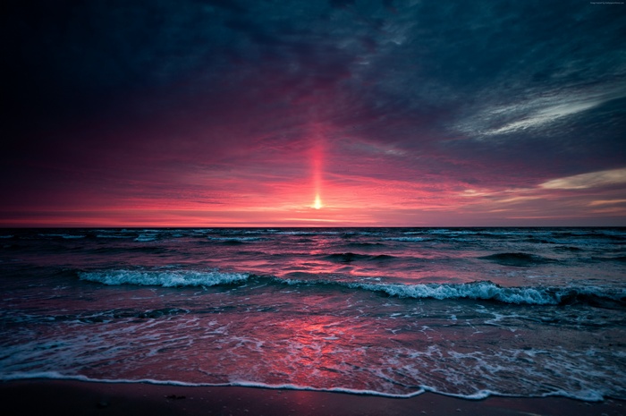 Ocean sunset with pink and blue sky