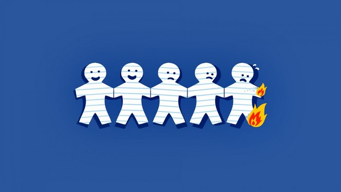 Paper people chain on blue background