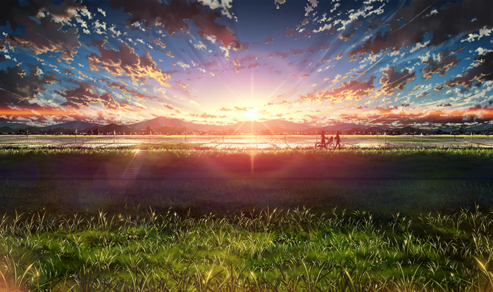 Sunset Over Serene Meadow with Silhouetted Figures