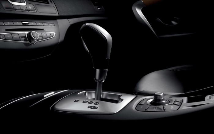 Car interior with automatic gear shifter and dashboard controls