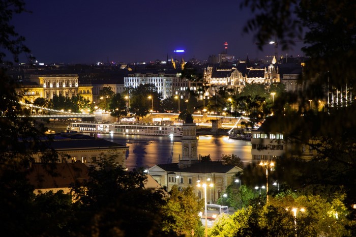 Budapest cityscape at night with Danube river and illuminated buildings