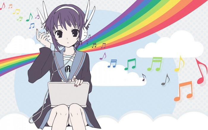 Girl with headphones and tablet listening to music
