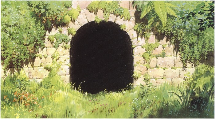 Stone Archway Covered in Vines and Overgrown with Grass