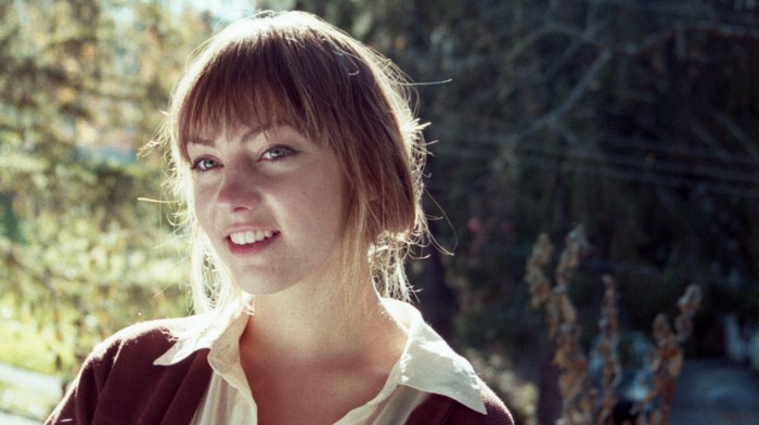 Angel Olsen smiling outdoors